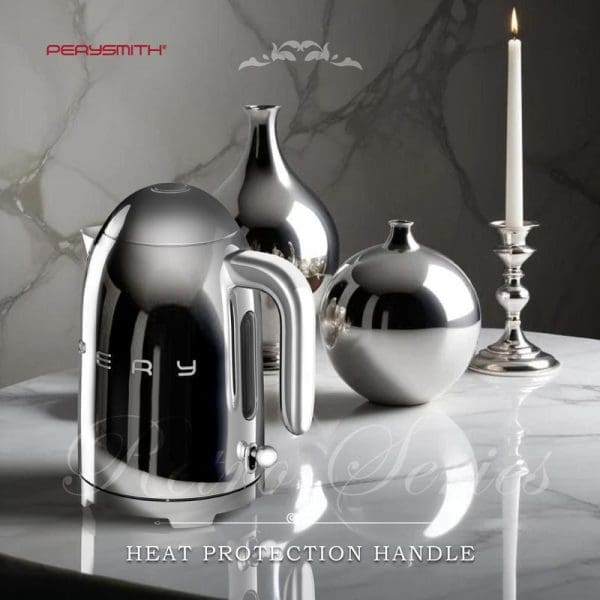 PerySmith KT1010 Retro Series electric kettle in polished chrome finish displayed on marble surface with decorative vases and lit candle, featuring heat protection handle.