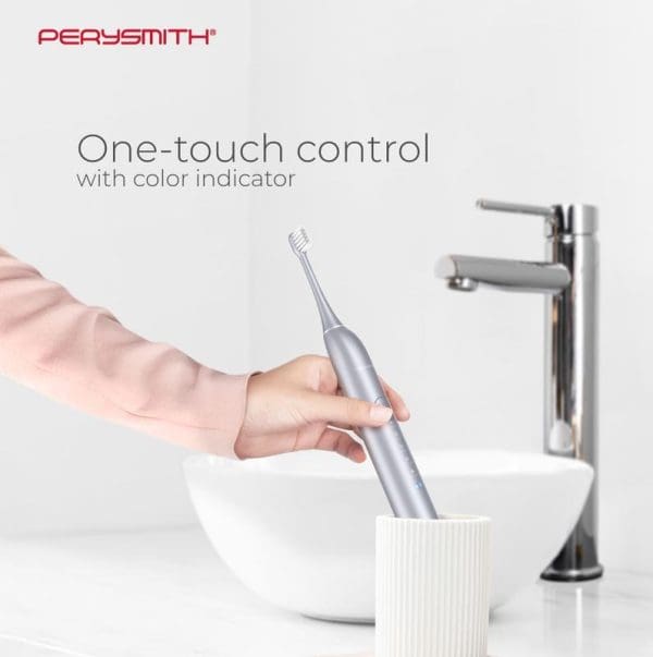 PerySmith iCare Series OX10 electric toothbrush with one-touch control and color indicator, shown being held over bathroom sink with modern faucet.