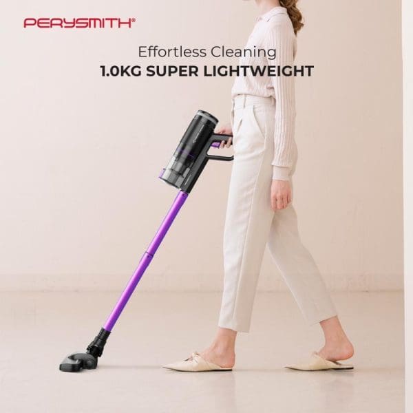 PerySmith Xtreme Series X10 Max cordless stick vacuum cleaner being used by woman in white outfit, featuring purple handle and lightweight 1.0kg design for effortless cleaning.
