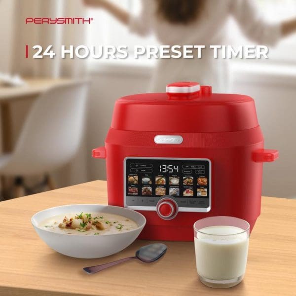 PerySmith PC1500 red smart pressure cooker with digital display and 24-hour preset timer on wooden counter with soup bowl and milk glass.