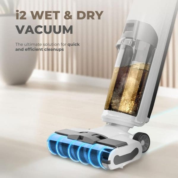 Russell Taylors i2 WET & DRY cordless vacuum cleaner with transparent dirt chamber and blue LED lights on floor attachment for wet and dry cleaning.