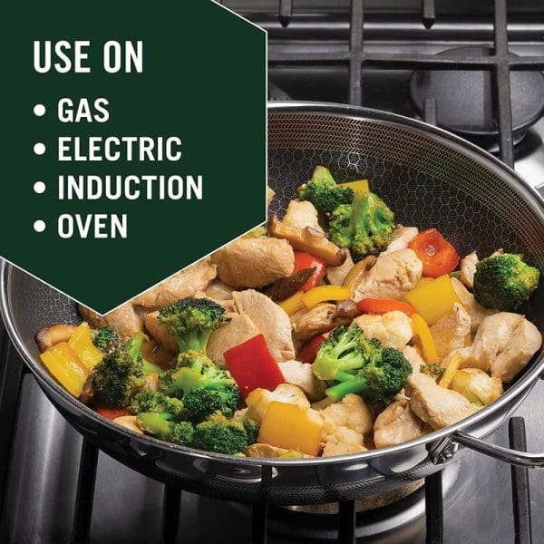 Russell Taylors 316 stainless steel non-stick honeycomb wok pan with lid containing colorful stir-fried vegetables and chicken, suitable for gas, electric, induction, and oven cooking.