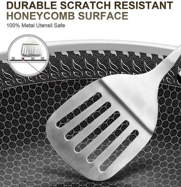 Russell Taylors 316 stainless steel non-stick honeycomb wok pan with metal spatula showing durable scratch-resistant surface and 100% metal utensil safe coating.
