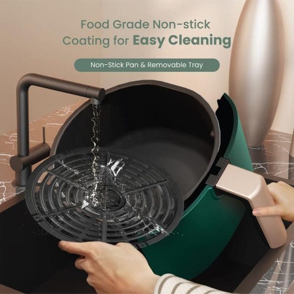 Russell Taylors 3D Air Fryer Large 4.2L Z1 with non-stick coating, removable tray being cleaned under running water, highlighting easy cleaning features.
