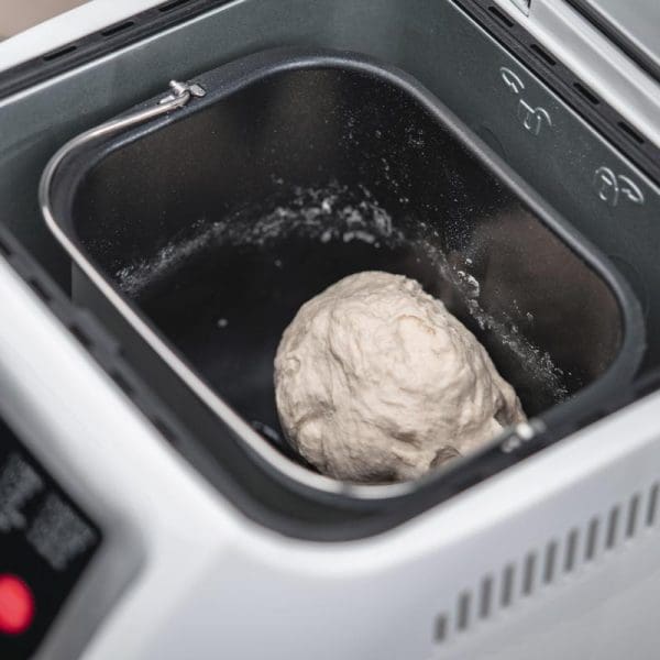 Russell Taylors Bread Maker BM-10 with 2.0LB capacity showing dough being kneaded inside the non-stick baking pan during bread making process.