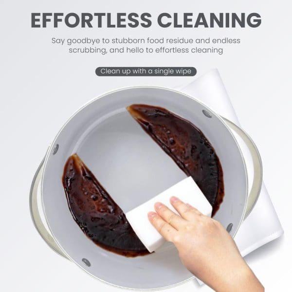 Russell Taylors Ceramic Non-Stick Cookware Set showing effortless cleaning with burnt food residue being wiped away easily with single paper towel from pan.