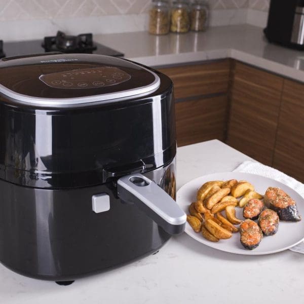 Russell Taylors Digital Rotary Air Fryer AF-76 7.5L black appliance on kitchen counter with plate of cooked food including fries and stuffed mushrooms.
