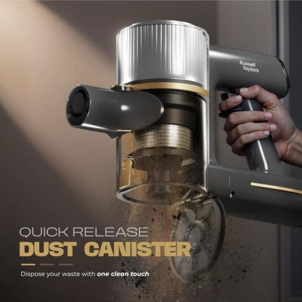 Russell Taylors Dynamic Cordless Vacuum Cleaner V2 with quick release dust canister being emptied, showing one-touch waste disposal feature and transparent collection chamber.