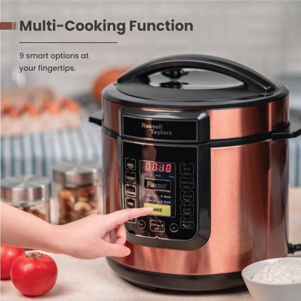 Russell Taylors PC-60 electric pressure cooker with copper finish, digital display, control panel, and 6L capacity showcasing multi-cooking functions in modern kitchen setting.