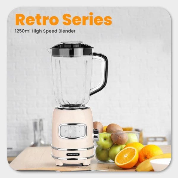 Russell Taylors Retro Series 1250ml High Speed Blender TB1 in cream color with glass pitcher, displayed on kitchen counter with fresh fruits including oranges and kiwis.