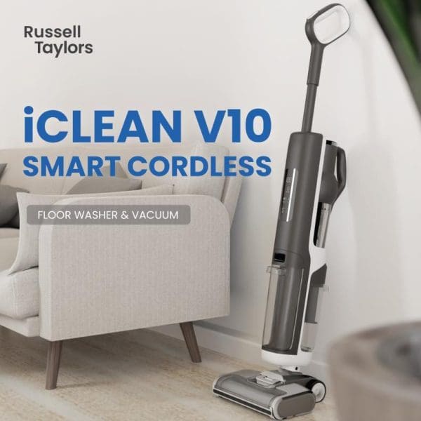 Russell Taylors iCLEAN V10 Smart Cordless Floor Washer & Vacuum in modern living room setting with gray and white chair furniture.