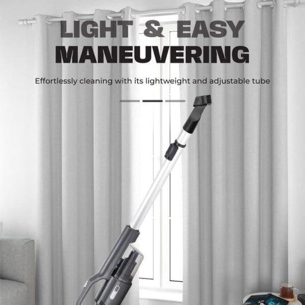 Russell Taylors Interchangeable Vacuum Cleaner V1 with lightweight adjustable tube, shown cleaning white curtains in modern living room, emphasizing easy maneuvering capabilities.