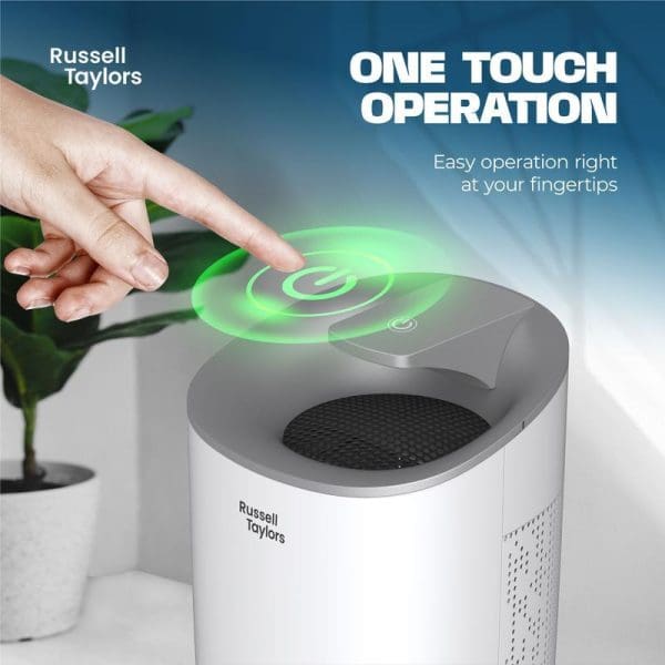 Russell Taylors Kappa Dehumidifier with one-touch operation, featuring a hand hovering over green touch controls, 600ml water tank, portable white design with ventilation grilles.