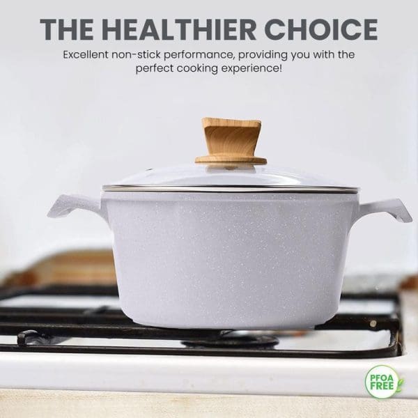 Russell Taylors white marble non-stick cookware pot with wooden handle lid on gas stove, featuring PFOA-free coating for healthier cooking experience.