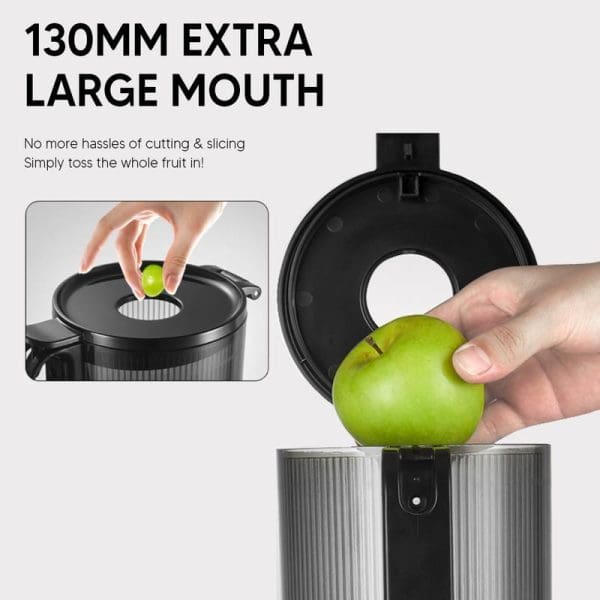 Russell Taylors Masticating Cold Press Slow Juicer SJ3 featuring 130mm extra large mouth opening, showing hand placing whole green apple into wide feeding tube.