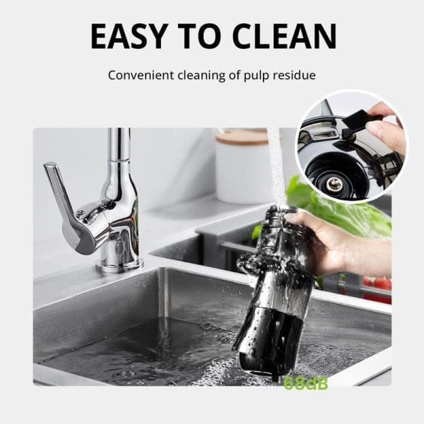 Russell Taylors Masticating Cold Press Slow Juicer SJ2 being cleaned under running water in kitchen sink, showing easy maintenance and pulp residue removal feature.