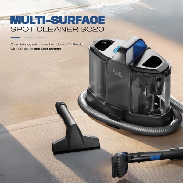 Russell Taylors Multi-Surface Spot Cleaner SC20 with hose and attachments on wooden floor, designed for cleaning fabrics, mirrors, windows, sofas and carpets.