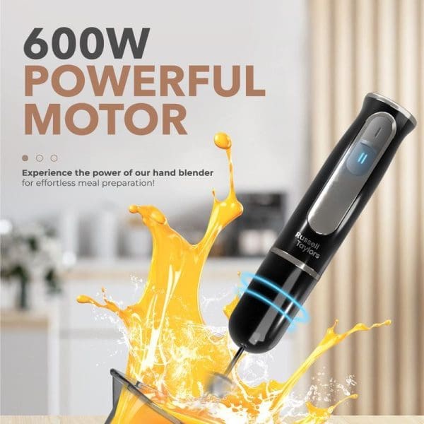 Russell Taylors 600W black hand blender with stainless steel blade creating orange liquid splash in kitchen setting, featuring powerful motor for effortless meal preparation.