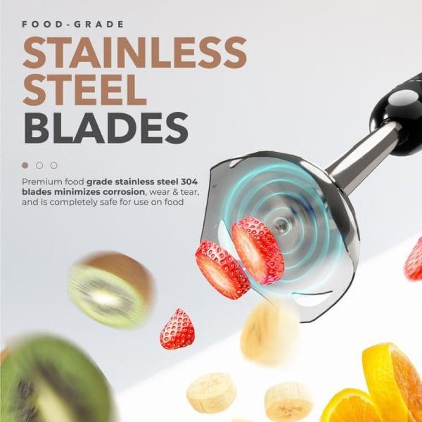 Russell Taylors 600W Hand Blender with stainless steel blades blending fruits including strawberries, kiwi, banana and orange slices in dynamic action shot.