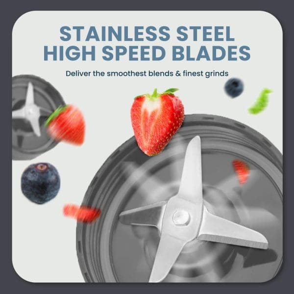 Russell Taylors Power Blender TB2 with stainless steel high-speed blades blending strawberries and blueberries, showcasing smooth blending capabilities for finest grinds.