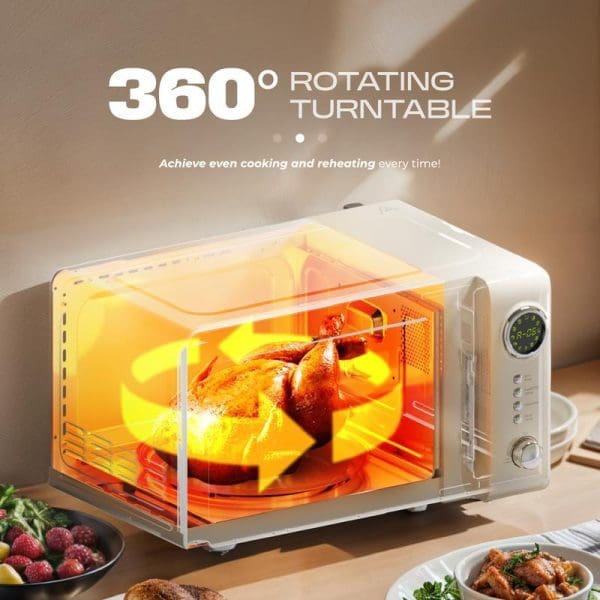 Russell Taylors Retro Microwave Oven 20L M2 with 360° rotating turntable, displaying glowing interior cooking chicken, digital display, white design on kitchen counter.