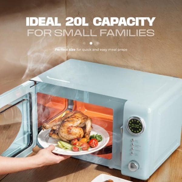 Russell Taylors Retro Microwave Oven 20L M2 in mint green with roasted chicken inside, featuring digital display and retro design, ideal for small families.