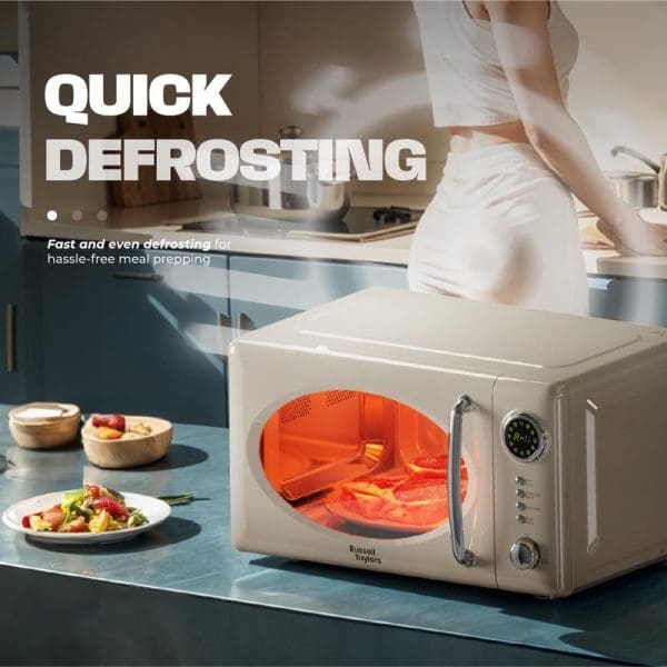 Russell Taylors Retro Microwave Oven 20L M2 in cream color with orange interior light, displaying quick defrosting feature for hassle-free meal preparation in modern kitchen setting.