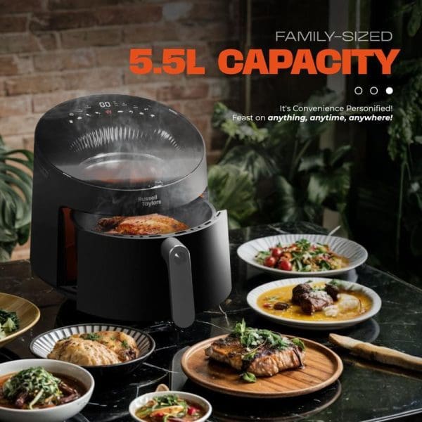 Russell Taylors Skylight View Bladeless Air Fryer 5.5L capacity with transparent dome, surrounded by various cooked dishes on plates in modern kitchen setting.