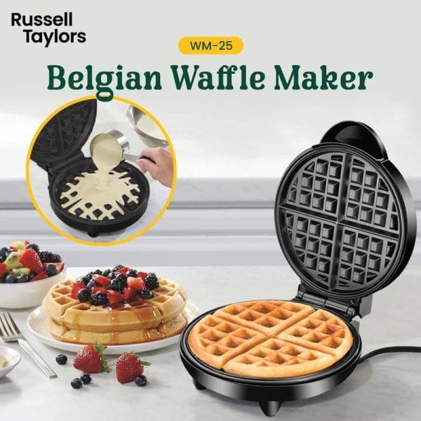 Russell Taylors WM-25 Belgian Waffle Maker with open lid showing cooked waffle inside, berries and finished waffles on plate in background.