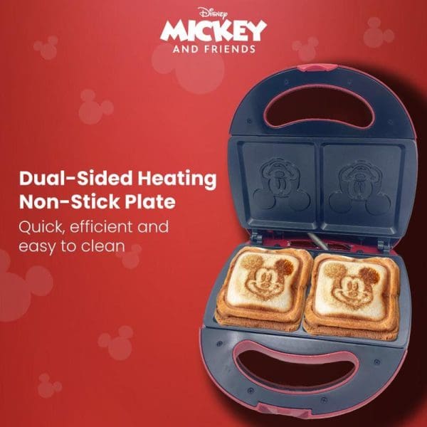 Russell Taylors Disney Mickey Mouse sandwich maker with dual-sided heating non-stick plates, showing two Mickey-shaped toasted sandwiches inside the open appliance.