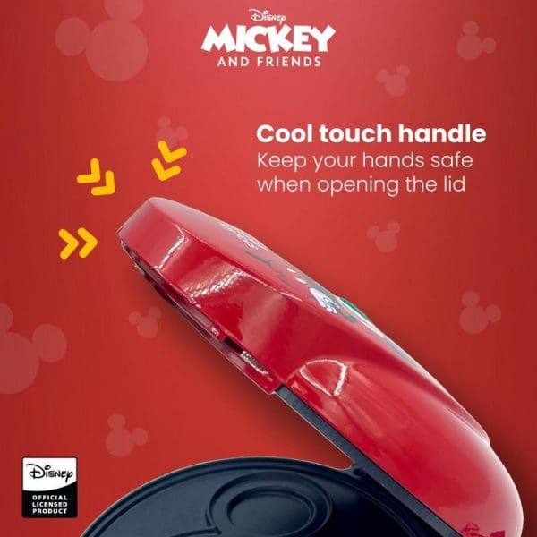 Red Disney Mickey waffle maker with cool-touch handle feature highlighted, showing opened lid and non-stick cooking surface on red background with Mickey head patterns.