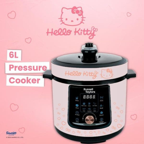 Russell Taylors Hello Kitty 6L Pressure Cooker with digital display, white body decorated with Hello Kitty graphics, black lid and control panel, on pink background.