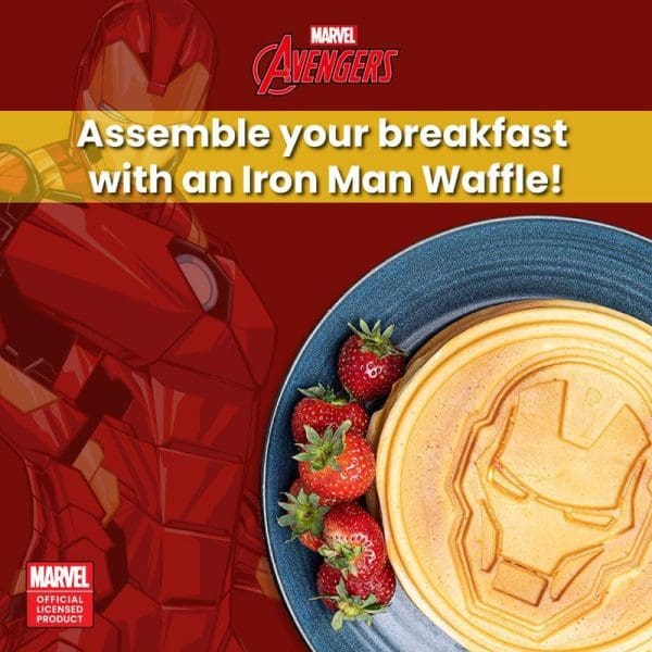 Marvel Avengers Iron Man waffle maker advertisement showing golden waffle with Iron Man helmet design and fresh strawberries on blue plate.